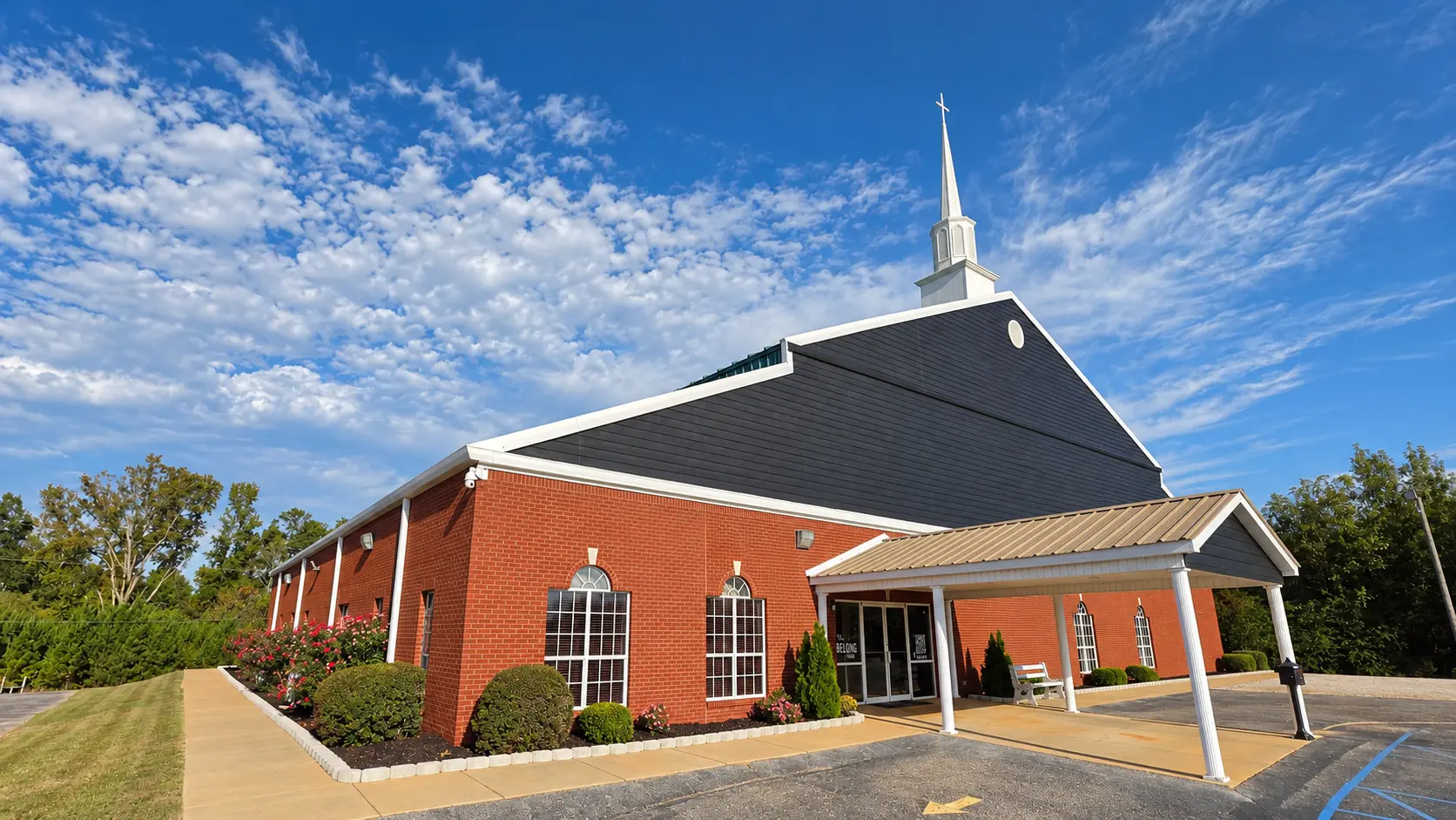 The front of No Limit Church with its updated siding and landscaping